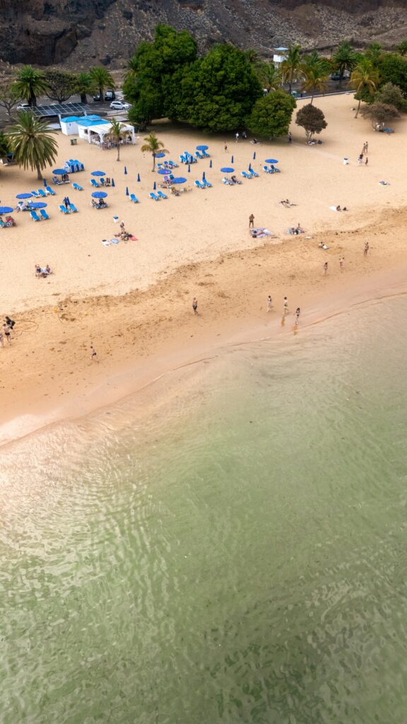 Aerial shot of Playa de las Teresitas in Tenerife, featuring sandy shores and turquoise waters.